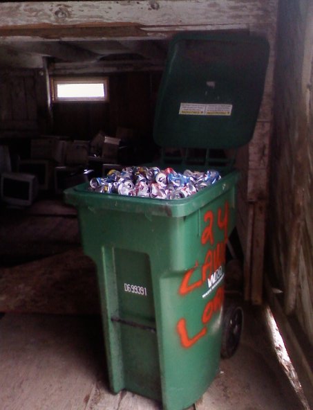 Crushed cans in a bin